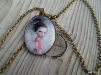 Colgante Bronce Niña Lazo Rosa